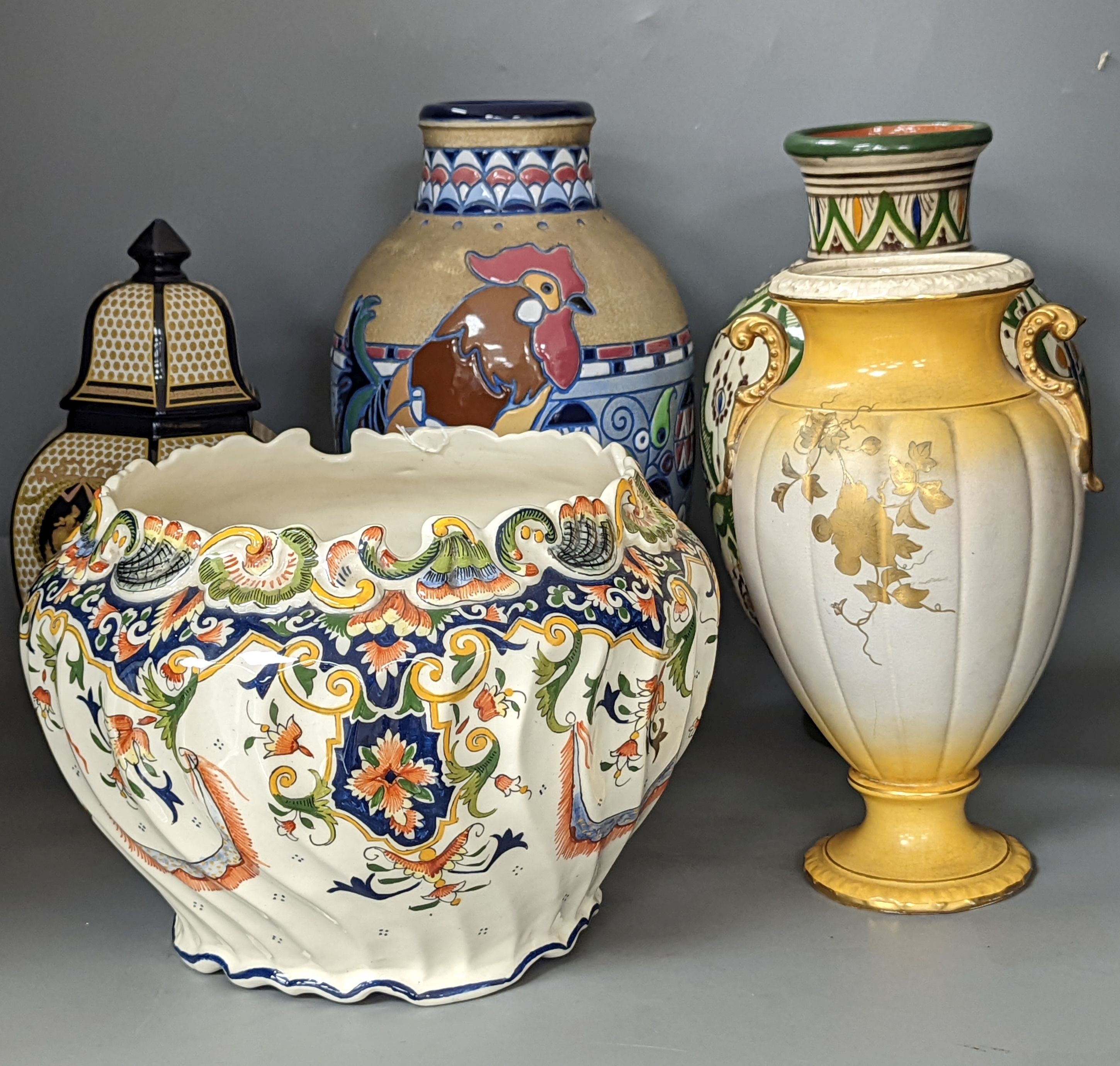 A Mont Saint Michael jardiniere, a lidded jar, two vases and an Amphora chicken decorated vase, Amphora vase 36 cms high.